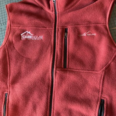 Embroidered logo on custom embroidered zip-up vests in Nampa