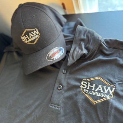 Custom embroidered hat and polo shirt with embroidered logo for a local plumbing company near Nampa, Idaho