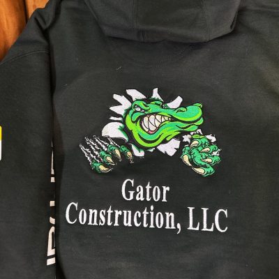 Custom embroidered hoodie with large back placement for a local construction company in Nampa, Idaho