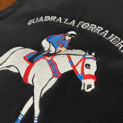 Custom embroidered jacket with large back placement from The Print Plug embroidery shop in Nampa