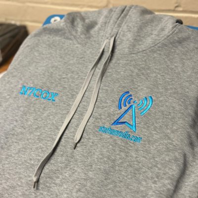 Custom embroidered hoodie with multiple placements from The Print Plug embroidery shop in Nampa