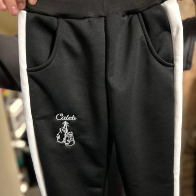 Custom embroidered logo on youth pants from The Print Plug in Nampa