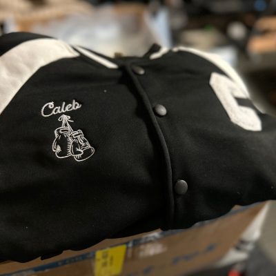 Custom embroidered letterman jacket for a kid from The Print Plug in Nampa