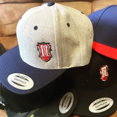 Custom embroidered baseball hats for a local tattoo shop