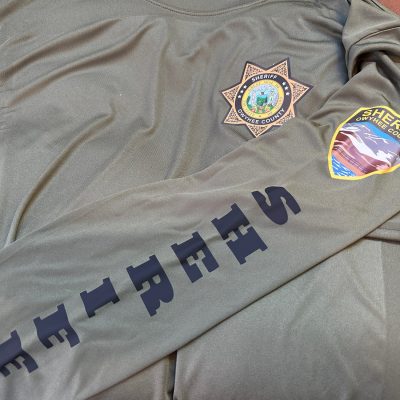 Custom HTV print on t-shirt with front placement and left sleeve for Nampa law enforcement