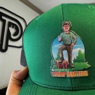 Custom vinyl patch on a baseball hat for a tree stump removal company in Nampa