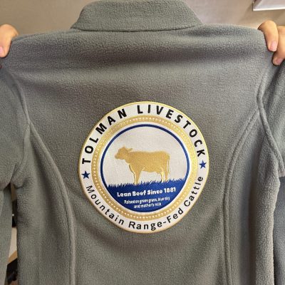 Large custom patch on the back of custom jackets at The Print Plug in Nampa