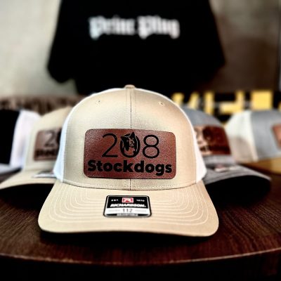 Custom leather patches on baseball hats made by The Print Plug