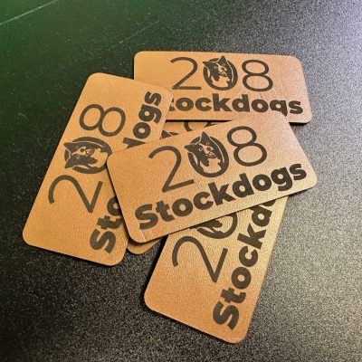 Custom leather patches ready to be applied onto a hat for a local brand