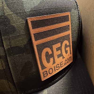 Custom faux leather patch on the left panel of camo baseball hats