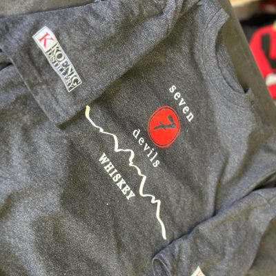 Screen printed custom t-shirts with front placement and sleeve prints in Nampa