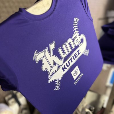 Screen printing custom t-shirts for a local sports team in Idaho