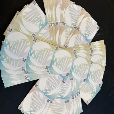 A pile of custom stickers at The Print Plug in Nampa