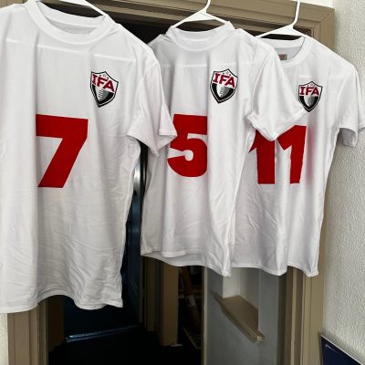 Screen printing and heat-transfer vinyl on sports team jerseys