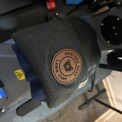Custom patches applied to beanies at The Print Plug