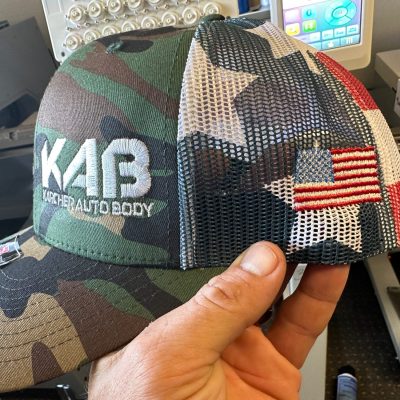 Custom baseball hat with front left panel and side panel embroidery