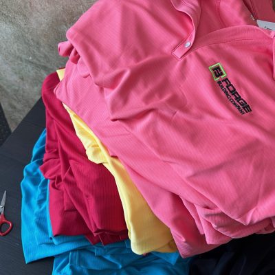 Custom business polos in bulk with logo embroidered on left chest