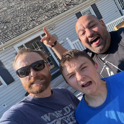 The Print Plug team posing outside the shop in Nampa