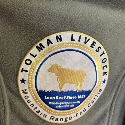 Custom logo embroidered onto the back of a shirt