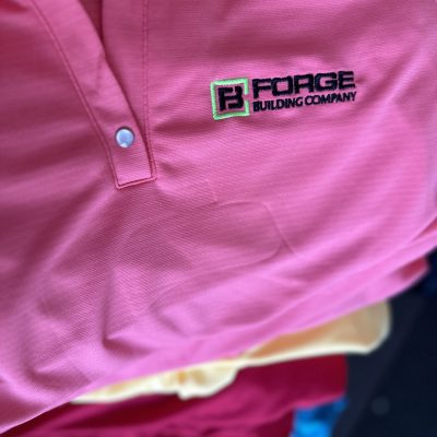 Custom polos with logo embroidered onto left chest in bulk