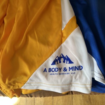 Screen printed design on basketball shorts for a local company