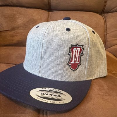 Custom embroidered left panel of baseball hat for local business