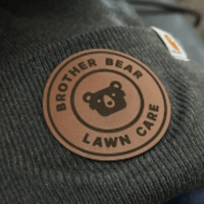 Custom patches applied to beanies at The Print Plug